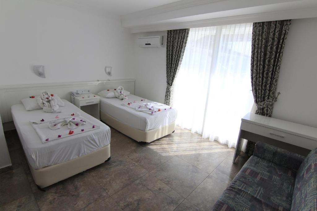 Postel nebo postele na pokoji v ubytování Bariscan Hotel