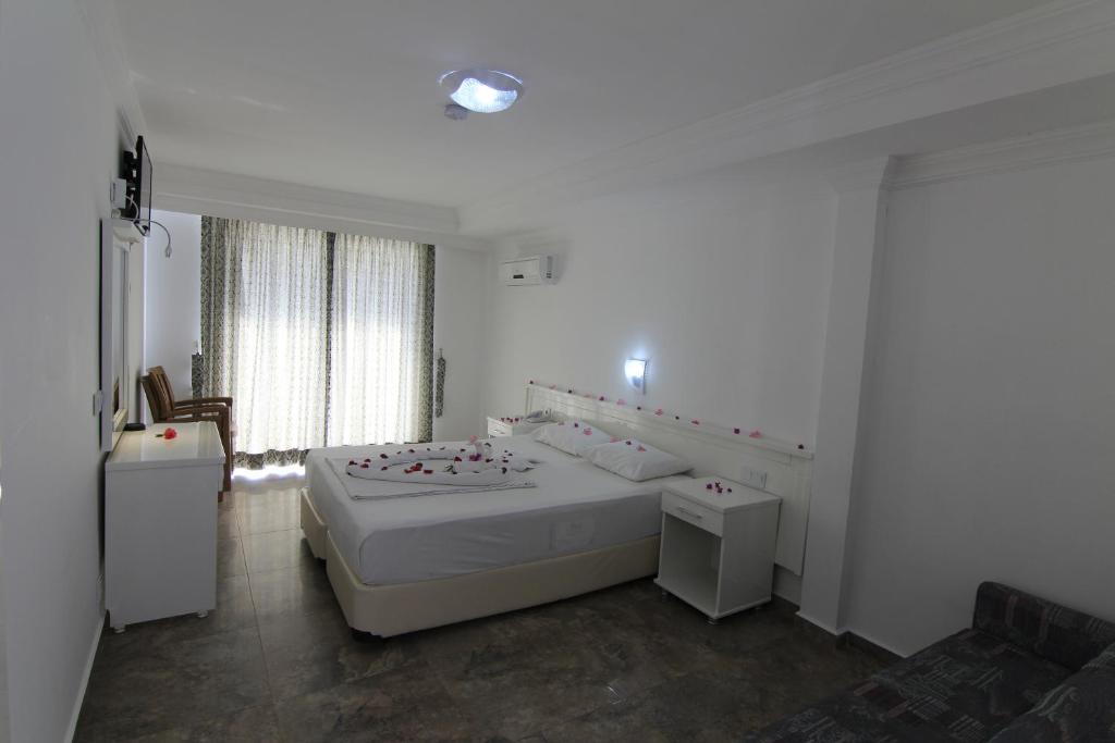Postel nebo postele na pokoji v ubytování Bariscan Hotel