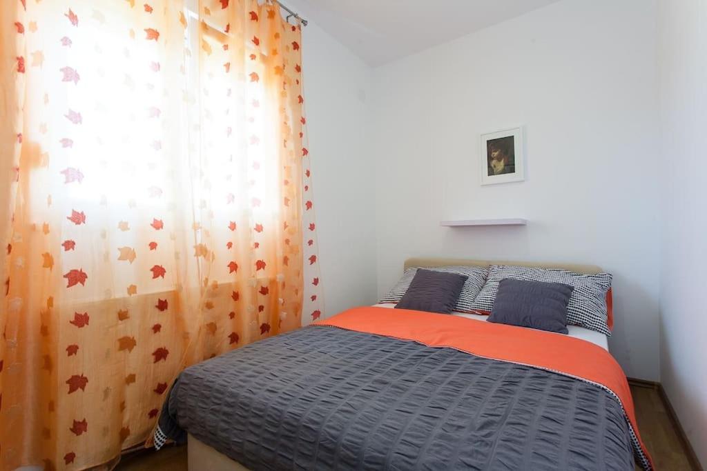 Postel nebo postele na pokoji v ubytování Apartmani Jukic