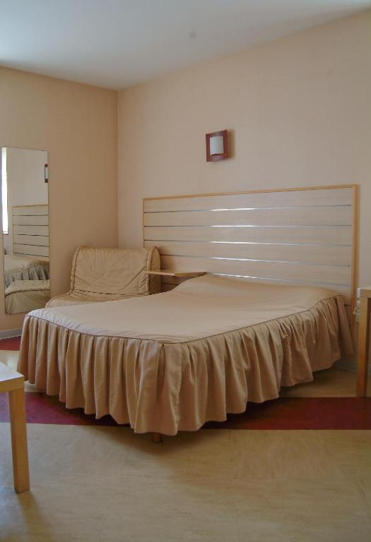 Postel nebo postele na pokoji v ubytování Hôtel Bertrand