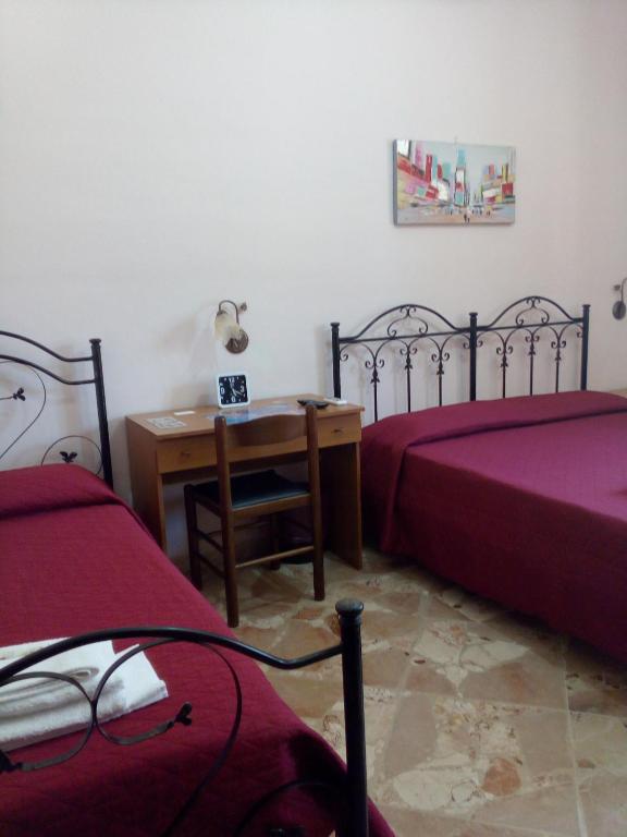 Postel nebo postele na pokoji v ubytování B&B Terra del Sole Agrigento San Leone