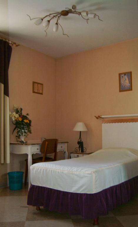 Postel nebo postele na pokoji v ubytování Hôtel Bertrand