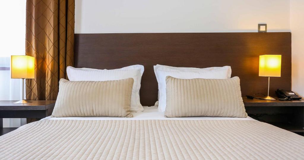 Postel nebo postele na pokoji v ubytování Hotel Divan