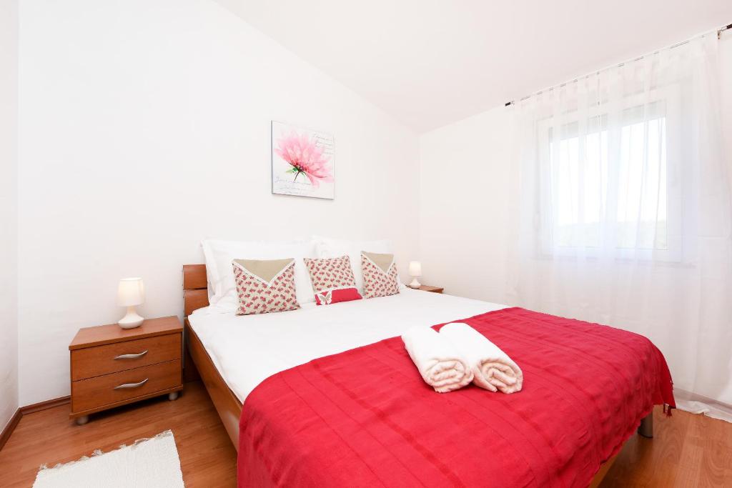Postel nebo postele na pokoji v ubytování Apartment Lola Maria