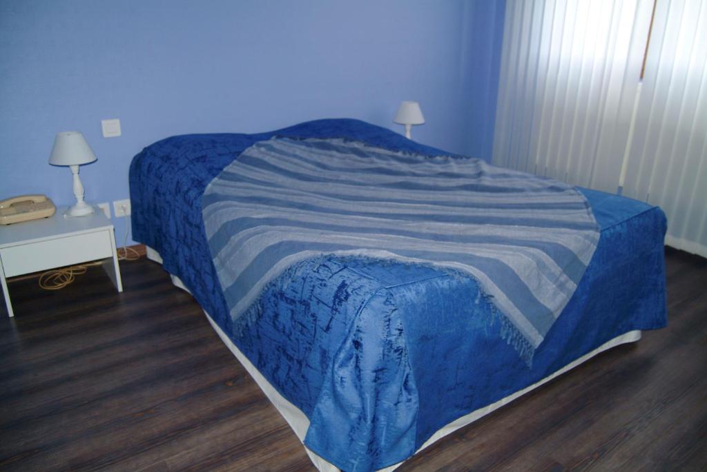 Postel nebo postele na pokoji v ubytování Hôtel Bertrand