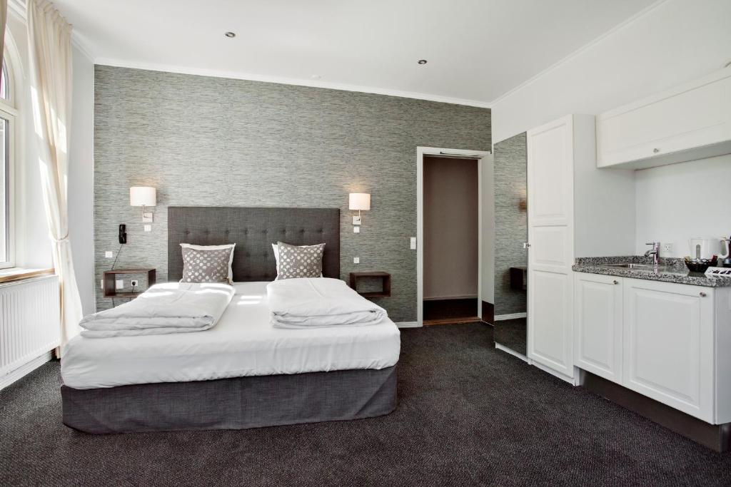 Postel nebo postele na pokoji v ubytování Hotel Tiffany