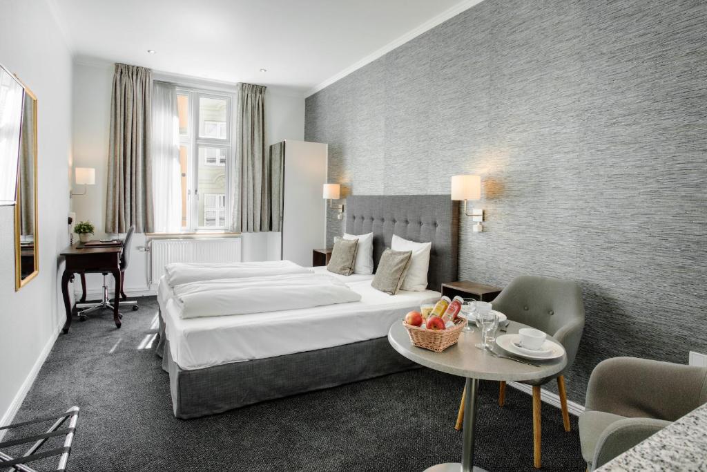 Postel nebo postele na pokoji v ubytování Hotel Tiffany