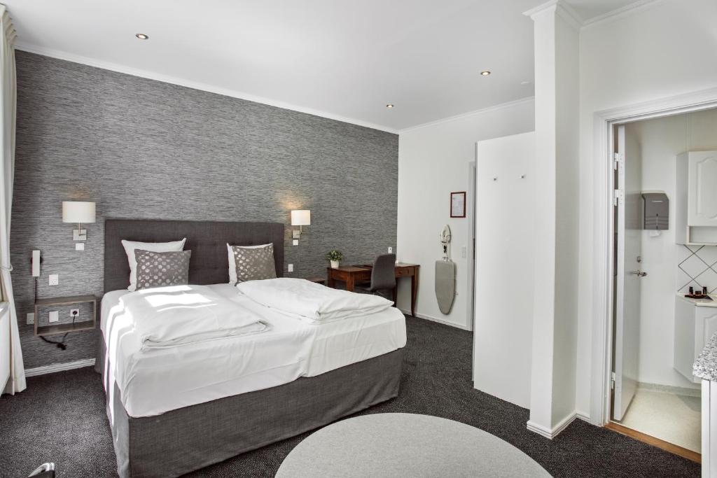 Postel nebo postele na pokoji v ubytování Hotel Tiffany