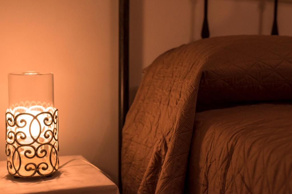 Łóżko lub łóżka w pokoju w obiekcie Aura Ortigia Apartments