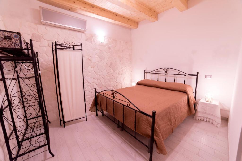 Łóżko lub łóżka w pokoju w obiekcie Aura Ortigia Apartments