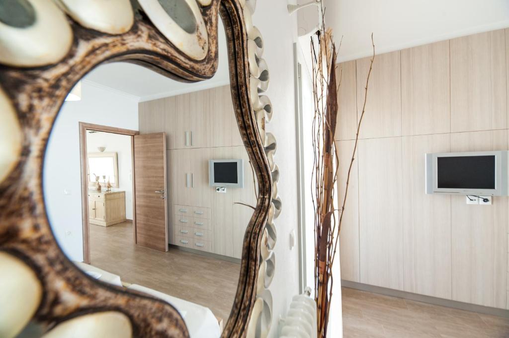 A television and/or entertainment centre at Panos Apartment Naousa