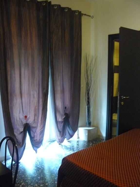 Postel nebo postele na pokoji v ubytování Hotel Vittoriano
