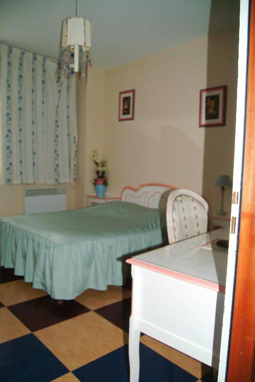 Postel nebo postele na pokoji v ubytování Hôtel Bertrand