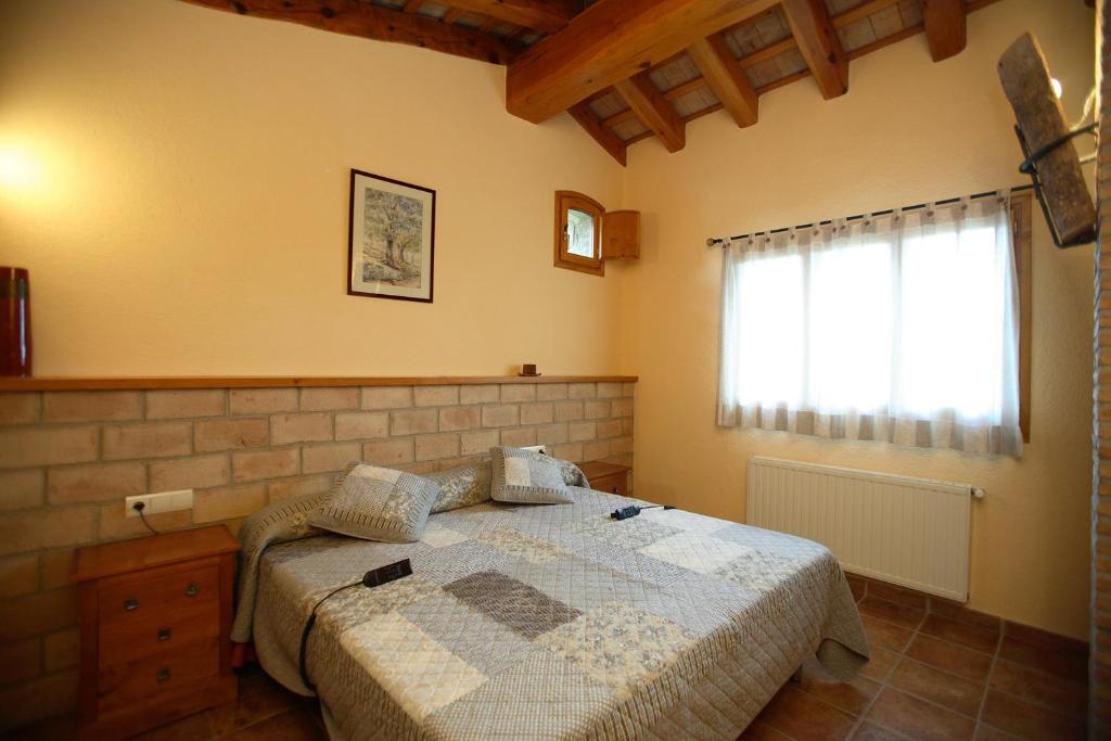 Postel nebo postele na pokoji v ubytování Entre Roures