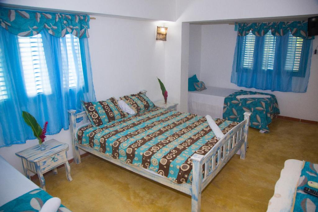 Postel nebo postele na pokoji v ubytování Casa Brisa Mar Hotel