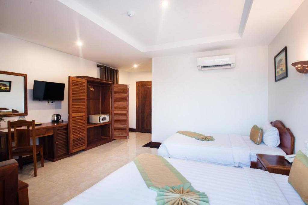 Postel nebo postele na pokoji v ubytování Relax Hotel