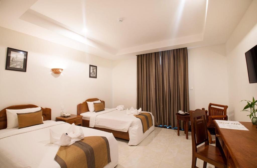 Postel nebo postele na pokoji v ubytování Relax Hotel