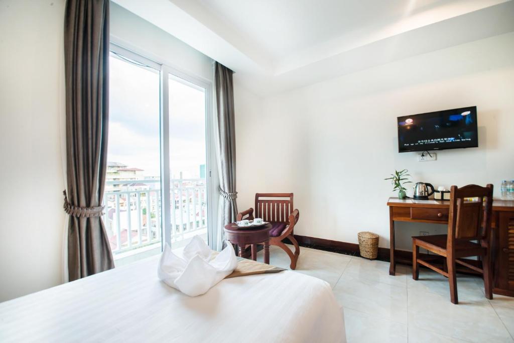 Postel nebo postele na pokoji v ubytování Relax Hotel