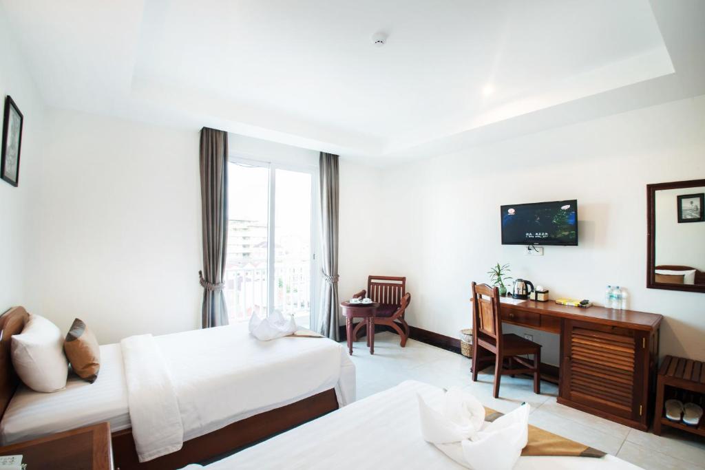Postel nebo postele na pokoji v ubytování Relax Hotel