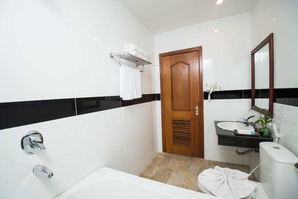 Koupelna v ubytování Relax Hotel