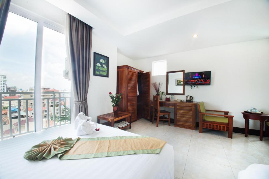 Postel nebo postele na pokoji v ubytování Relax Hotel
