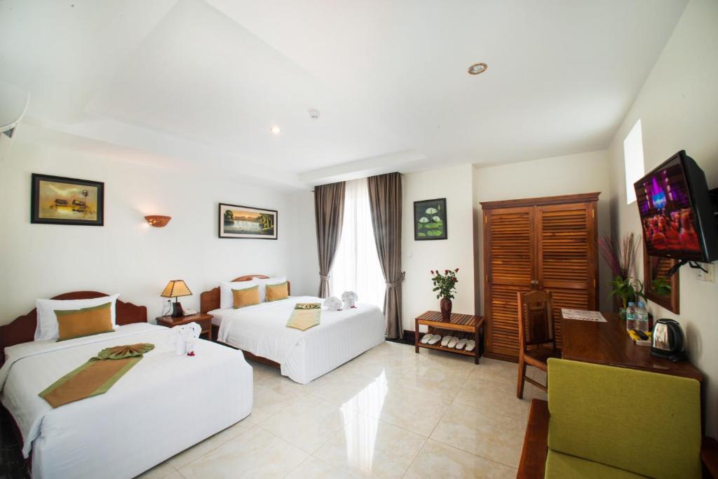 Postel nebo postele na pokoji v ubytování Relax Hotel