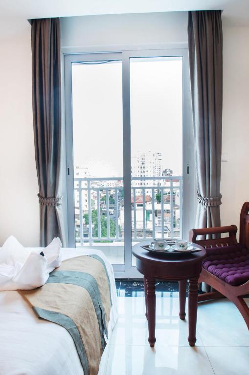 Postel nebo postele na pokoji v ubytování Relax Hotel