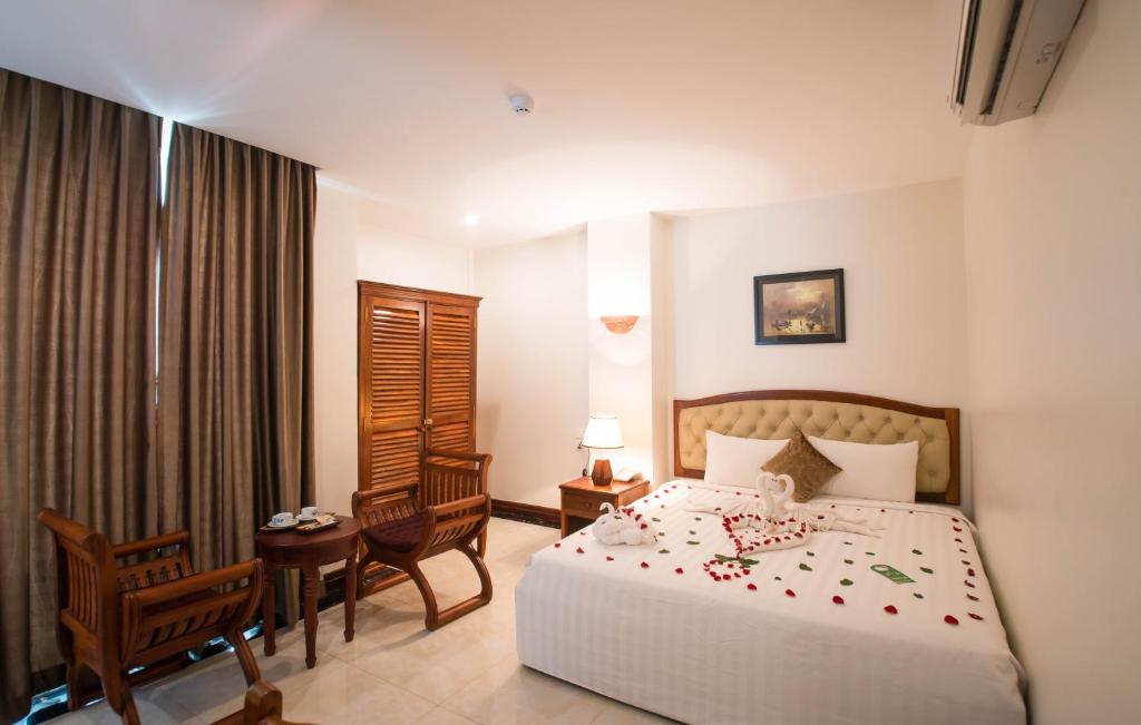 Postel nebo postele na pokoji v ubytování Relax Hotel