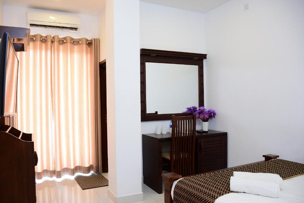 Postel nebo postele na pokoji v ubytování Hotel Bamiyan