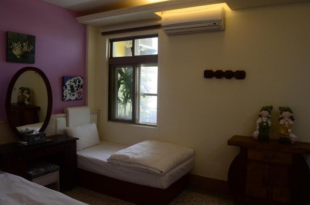 Postel nebo postele na pokoji v ubytování Jia Yuan Homestay