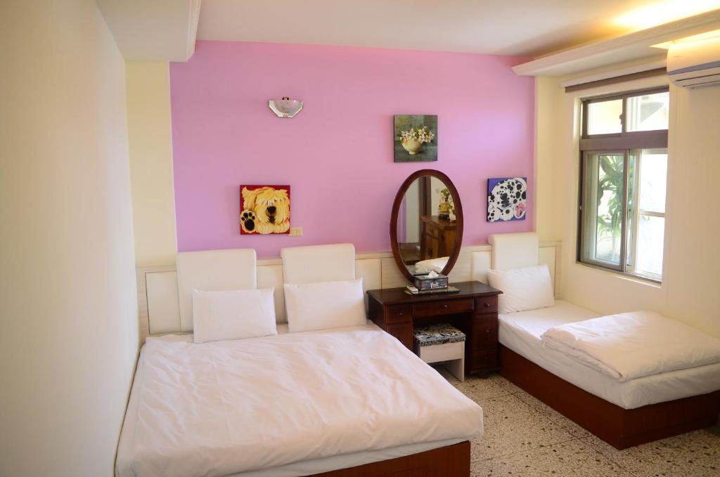 Postel nebo postele na pokoji v ubytování Jia Yuan Homestay
