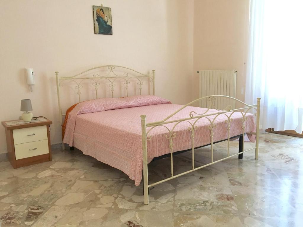 Un pat sau paturi într-o cameră la Casa nel Salento da Grace