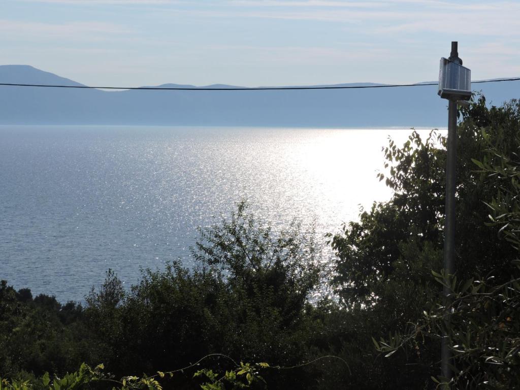 a view of the ocean from a house at Apartment Areta in Ravni