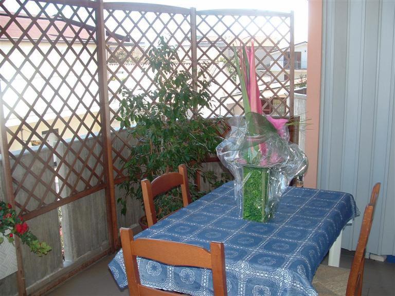 a table with a vase sitting on top of it at Bed & Breakfast Oasi in Pescara