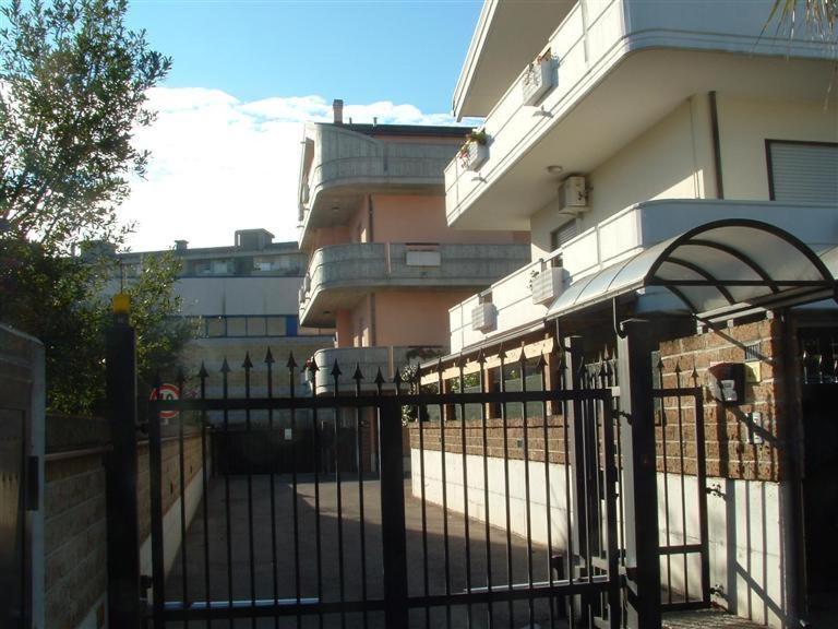 a black fence in front of a building at Bed & Breakfast Oasi in Pescara