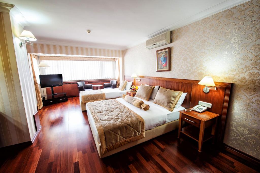 Giường trong phòng chung tại Hotel Centrum Istanbul