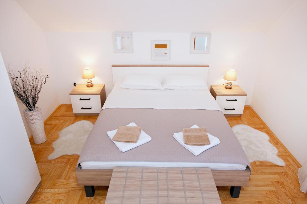 Ліжко або ліжка в номері Apartment Majetić