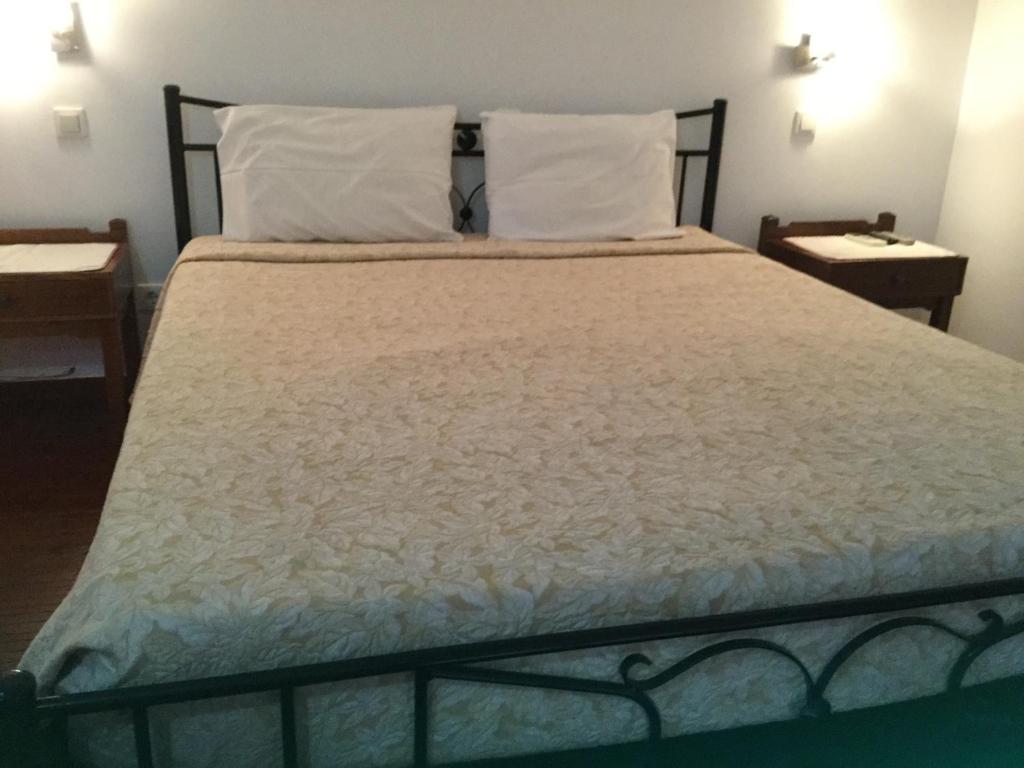 Postel nebo postele na pokoji v ubytování Captain's Suites