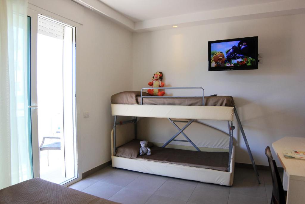 Postel nebo postele na pokoji v ubytování Hotel Augustus- Davanti a noi c'è solo il mare
