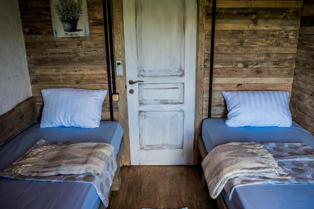 Postel nebo postele na pokoji v ubytování Rosemarino Country House