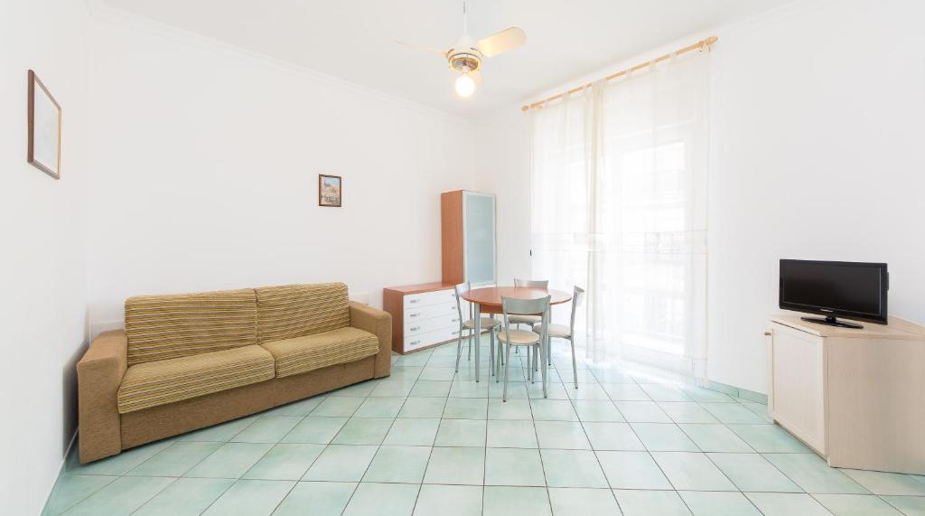 a living room with a couch and a table at La Residenza Aparthotel in Maiori