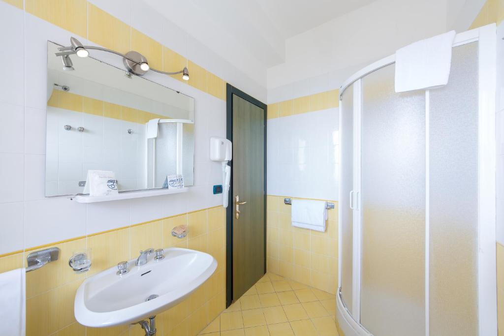 a bathroom with a sink and a shower at La Residenza Aparthotel in Maiori