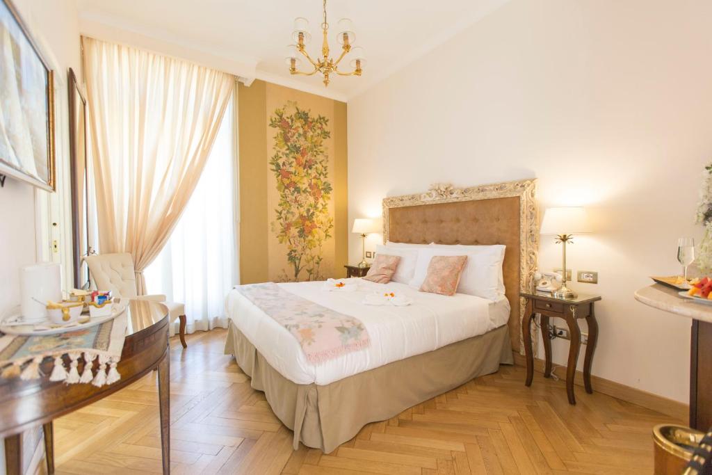 Posteľ alebo postele v izbe v ubytovaní Royal Suite Trinità Dei Monti