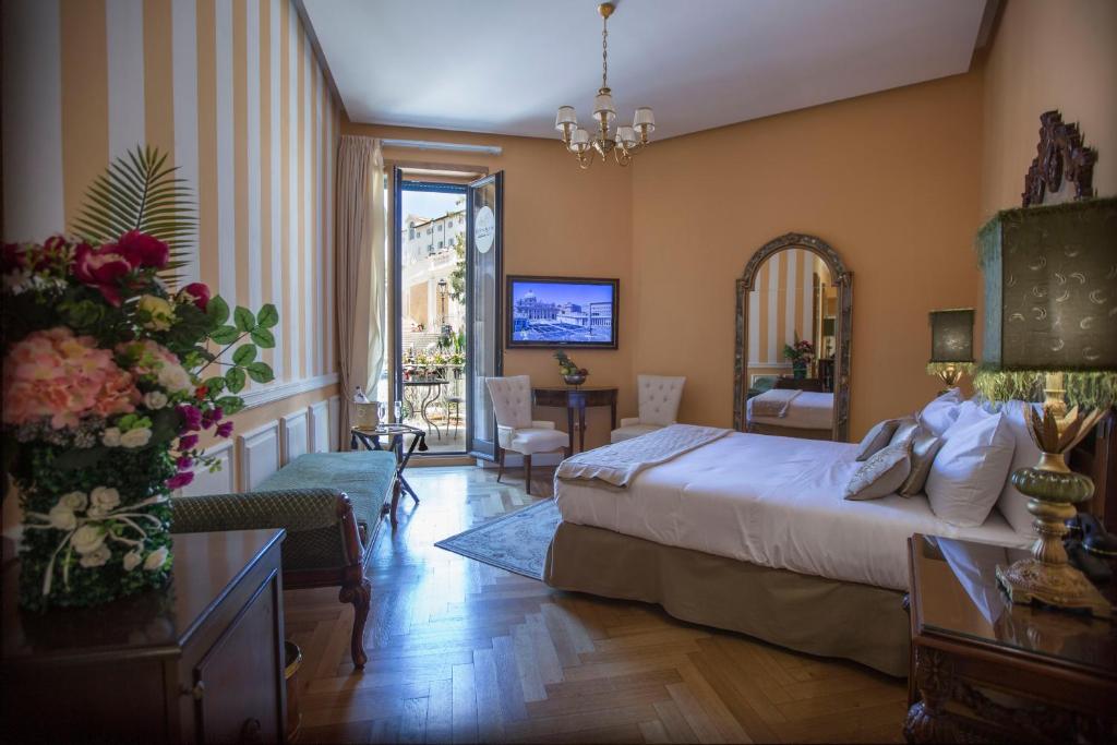 Posteľ alebo postele v izbe v ubytovaní Royal Suite Trinità Dei Monti