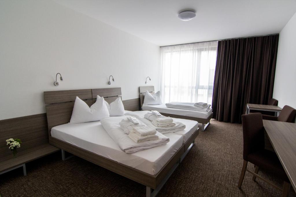 Postel nebo postele na pokoji v ubytování Lifestyle Hotel Leithana