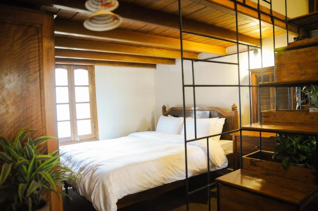 Postel nebo postele na pokoji v ubytování Tuti Tong Dan Homestay