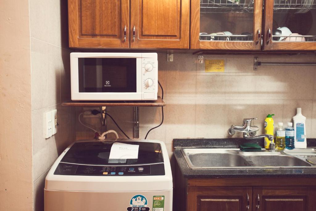 Kuchyň nebo kuchyňský kout v ubytování Tuti Tong Dan Homestay
