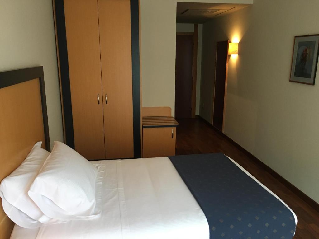 Letto o letti in una camera di Plus Welcome Milano