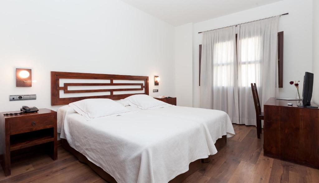 Postel nebo postele na pokoji v ubytování Casa del Trigo