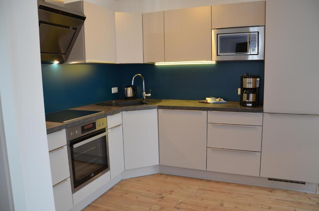 Kuchyň nebo kuchyňský kout v ubytování Apartment Haus Van der Leij
